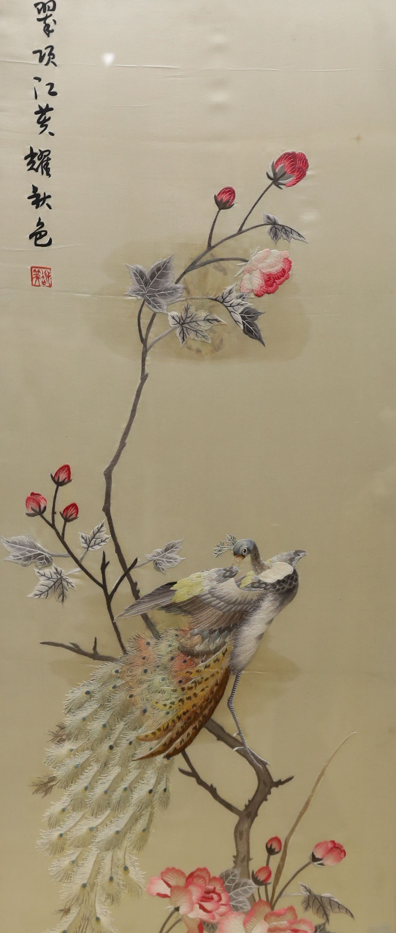 A Chinese silkwork panel of a peacock upon flowering branches, 112 x 35cm and a colour print of Chinese polo players